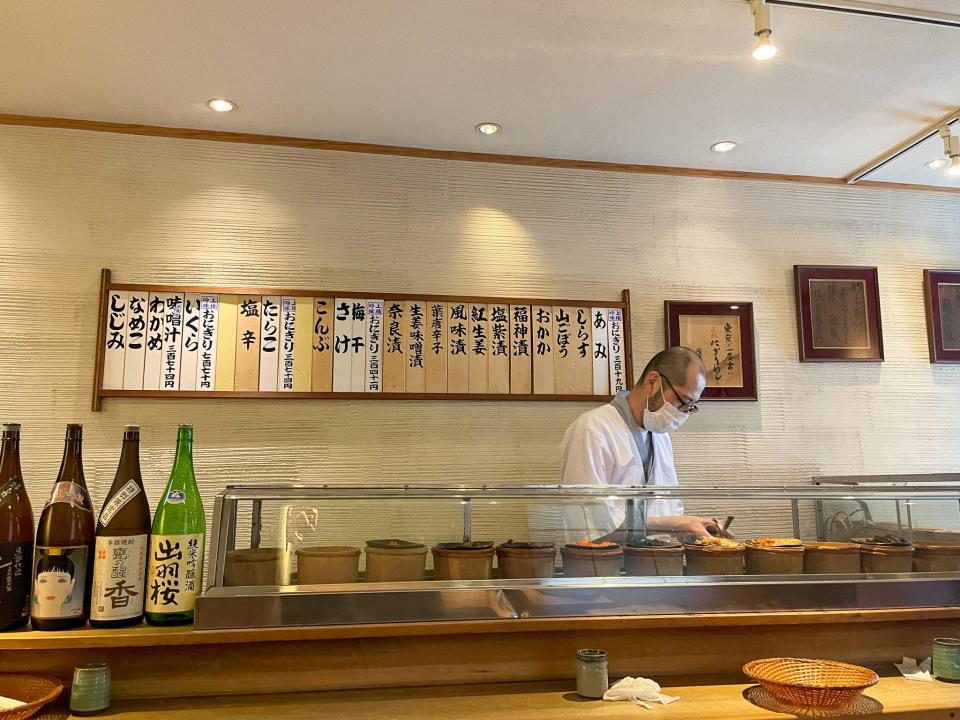 The restaurant's chef makes onigiri.