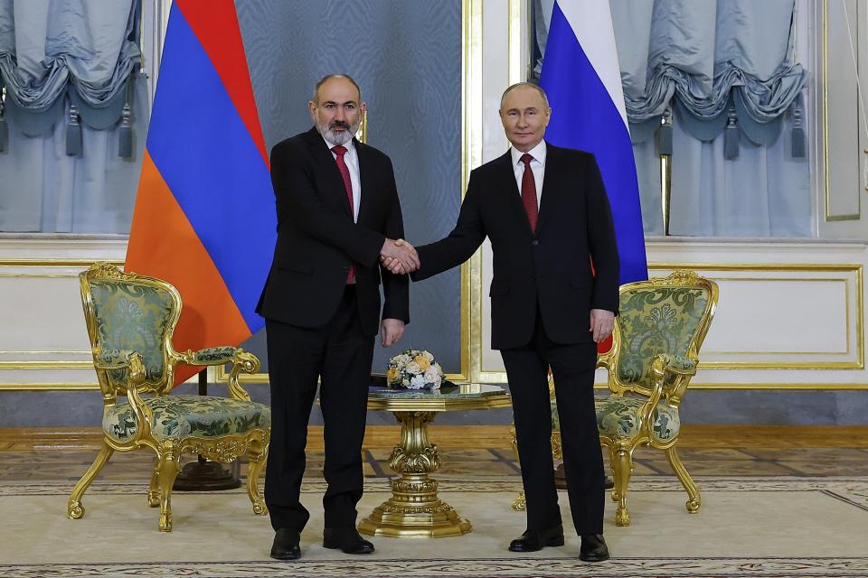 Russian President Vladimir Putin, right, and Armenian Prime Minister Nikol Pashinyan shake hands prior to their talks on the sidelines of a meeting of the Eurasian Economic Union at the Kremlin in Moscow, Russia, on Wednesday, May 8, 2024. Russian President Vladimir Putin hailed the economic alliance's performance, saying that it helped boost the members' economic potential. (Evgenia Novozhenina/Pool Photo via AP)