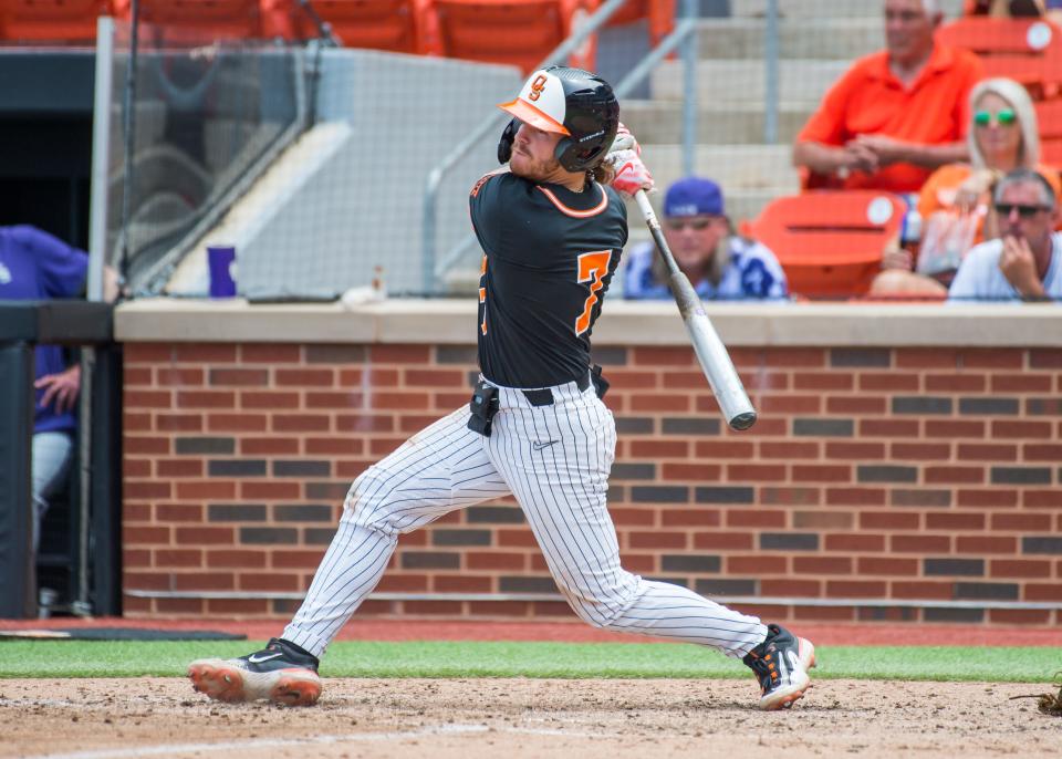 Roc Riggio, now a member of the Hudson Valley Renegades, is photographed mid-swing while playing for Oklahoma State during a May 13, 2023 game.