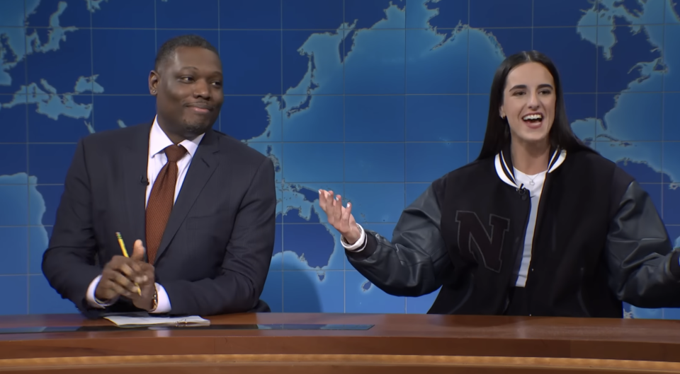 Closeup of Michael Che and Caitlin Clark on "SNL"