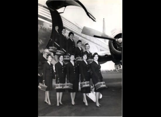 Sorelle Fontana, 1950-1960  The Alitalia uniform was designed by Micol and Zoe Fontana, whose interpretation included a long dark skirt that fell well below the knee complete with a blue 3 button jacket.  Their style was a representation of women working outside the home after the war.