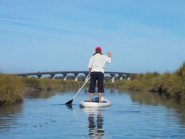 Louisa Rogers paddling on Humboldt Bay.