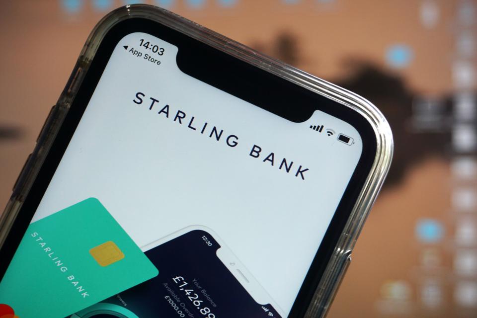 A photograph arranged as an illustration in Hartley Wintney, west of London on August 19, 2020 shows the Starling Bank banking app on a smart phone. - In the nation's booming financial technology or fintech sector, mobile phone app-based 