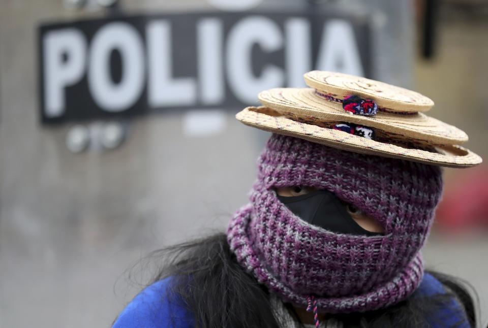 A Misak Indigenous woman takes part in an anti-government protest triggered by proposed tax increases on public services, fuel, wages and pensions, in Bogota, Colombia, Wednesday, June 9, 2021. (AP Photo/Fernando Vergara)