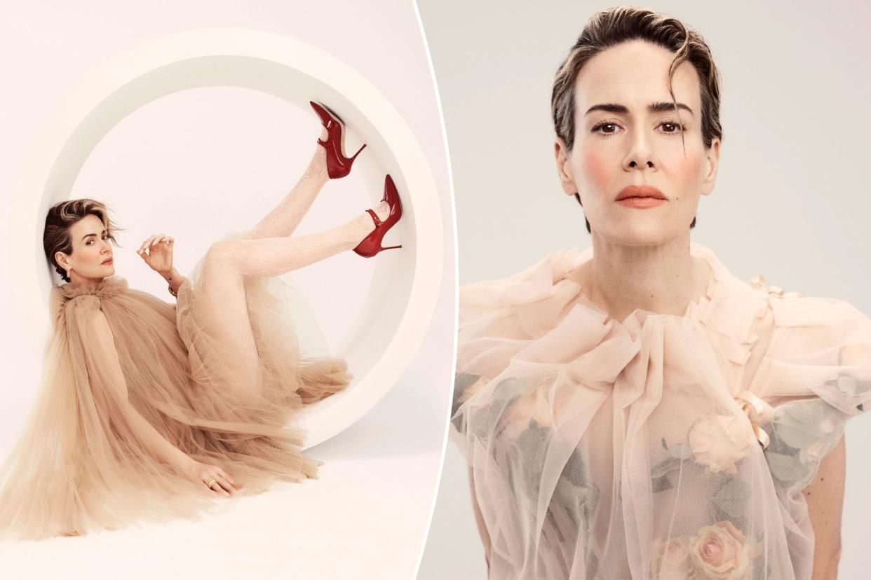 Sarah Paulson posing in designer clothing.