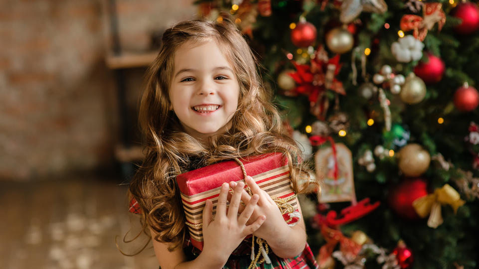 <p>A majority of parents say they spend more over the holidays than they should, according to a survey by T. Rowe Price. In fact, 53 percent agree with the statement, “I try to get everything on my kids’ lists, no matter how much it costs.” As a result, some parents pay for purchases by raiding their retirement accounts or emergency funds or getting a payday loan, the survey found.</p> <p>Don’t feel compelled to add everything from your kids’ wish list to your shopping list. Instead, talk with your children about budgets and trade-offs, <span>said Marty Allenbaugh, senior relationship manager with T. Rowe Price.</span> In fact, having a conversation about family finances can be <a href="https://www.gobankingrates.com/saving-money/dont-let-santa-spoil-kids/?utm_campaign=1013470&utm_source=yahoo.com&utm_content=27" rel="nofollow noopener" target="_blank" data-ylk="slk:the most valuable gift you give your kids;elm:context_link;itc:0;sec:content-canvas" class="link ">the most valuable gift you give your kids</a>, he said.</p>