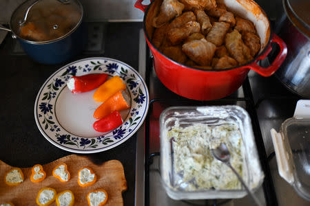 Food is served at the home of Adi and Maria in London, Britain, February 17, 2019. Adi and Maria often cook Romanian food, such as sarmale and eat Romanian cheese sent by their parents. REUTERS/Alecsandra Dragoi