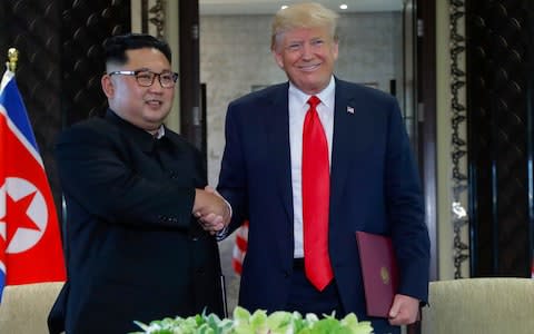 Donald Trump and Kim Jong-un in June in Singapore - Credit:  Evan Vucci/ AP