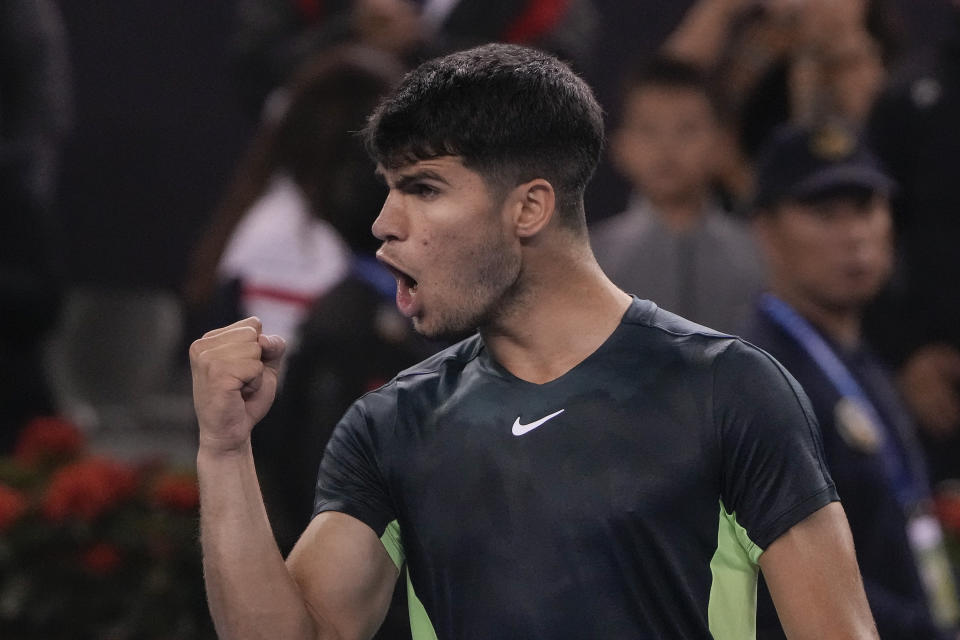 Carlos Alcaraz of Spain celebrates after defeating Casper Ruud of Norway in the men's singles quarterfinal match of the China Open tennis tournament at the Diamond Court in Beijing, Monday, Oct. 2, 2023. (AP Photo/Andy Wong)
