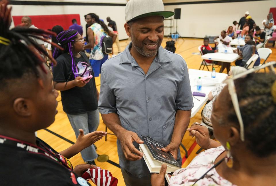 Mike Epps signs autographs Tuesday, Aug. 29, 2023, during the Back to School Essential Giveaway to Empower Indianapolis Students at the JTV Hill Center in Indianapolis.