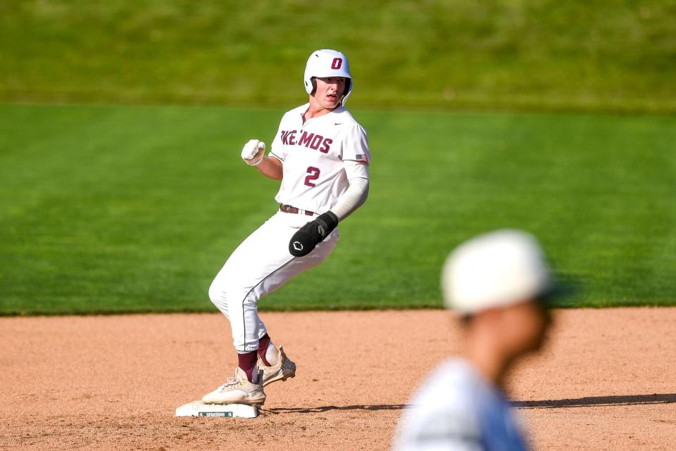 Okemos'  Caleb Bonemer makes it to second base during the sixth inning on Wednesday, May 31, 2023, at McLane Stadium on the Michigan State campus in East Lansing.