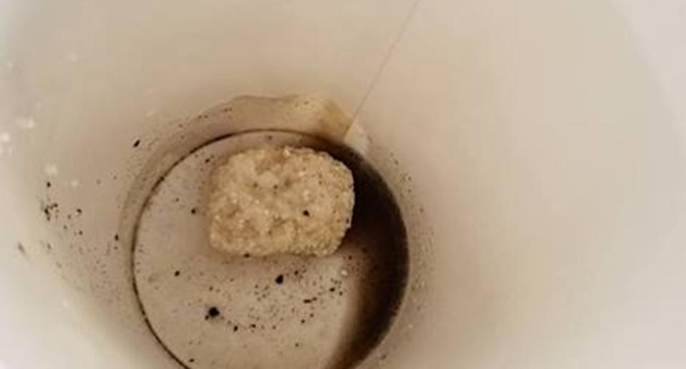 The Florida man shared this image, saying he found what appeared to be a laundry tablet at the bottom of his Coke. Source: Facebook/Lee Graves