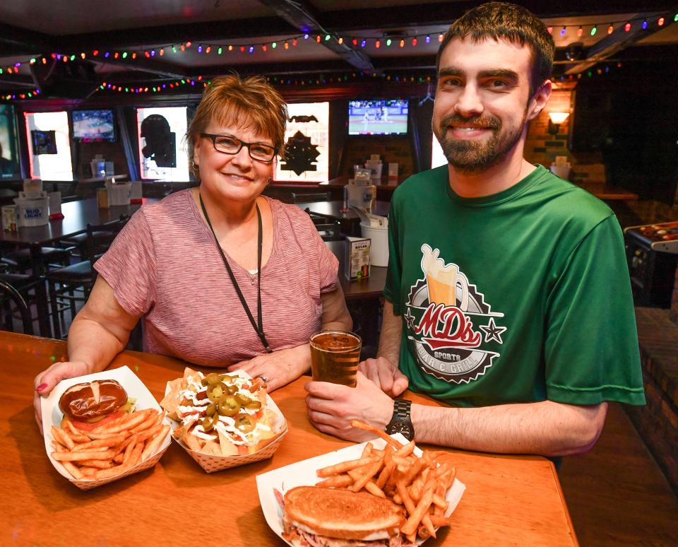 RON JOHNSON/JOURNAL STAR MaryBeth Milburn and son Dan Gilfillan of MD's Sports Bar and Grill at 7719 N. University St.