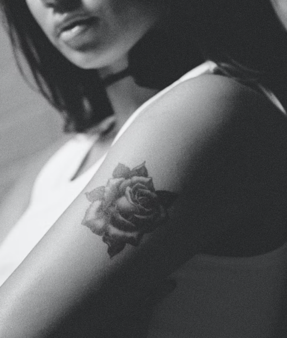 model wearing rose temporary tattoo