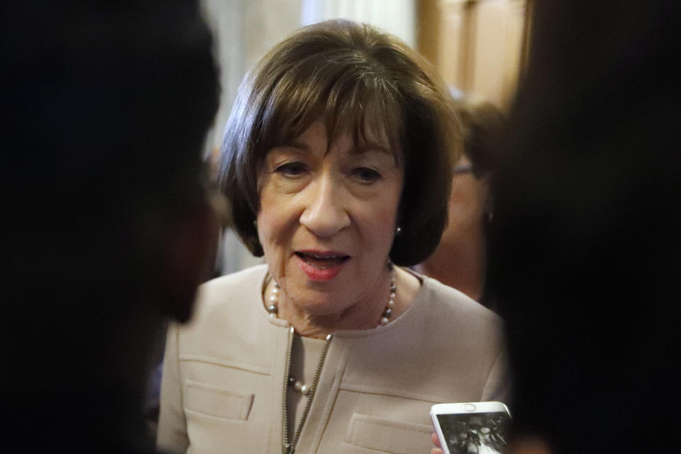 FILE - In this Oct. 5, 2018 file photo, Sen. Susan Collins, R-Maine, talks with reporters after speaking on the Senate floor, on Capitol Hill in Washington. The fight over President Donald Trump’s border wall is heading to the GOP-controlled U.S. Senate, putting Republicans in the uncomfortable spot of deciding whether to back his declaration of a national emergency(AP Photo/Alex Brandon)