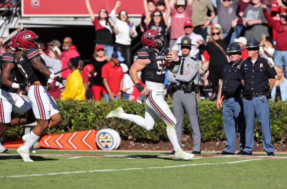 South Carolina linebacker Stone Blanton (52) returns an interception for a touchdown during the second half of the Gamecocks’ game at Williams-Brice Stadium in Columbia on Saturday, November 4, 2023. Sam Wolfe/Special To The State