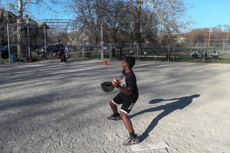 Davion Bell, 13, of the Motor City Ravens youth baseball team, throws a pitch during practice at Calcara Park in Detroit on Wednesday, April 13, 2023.