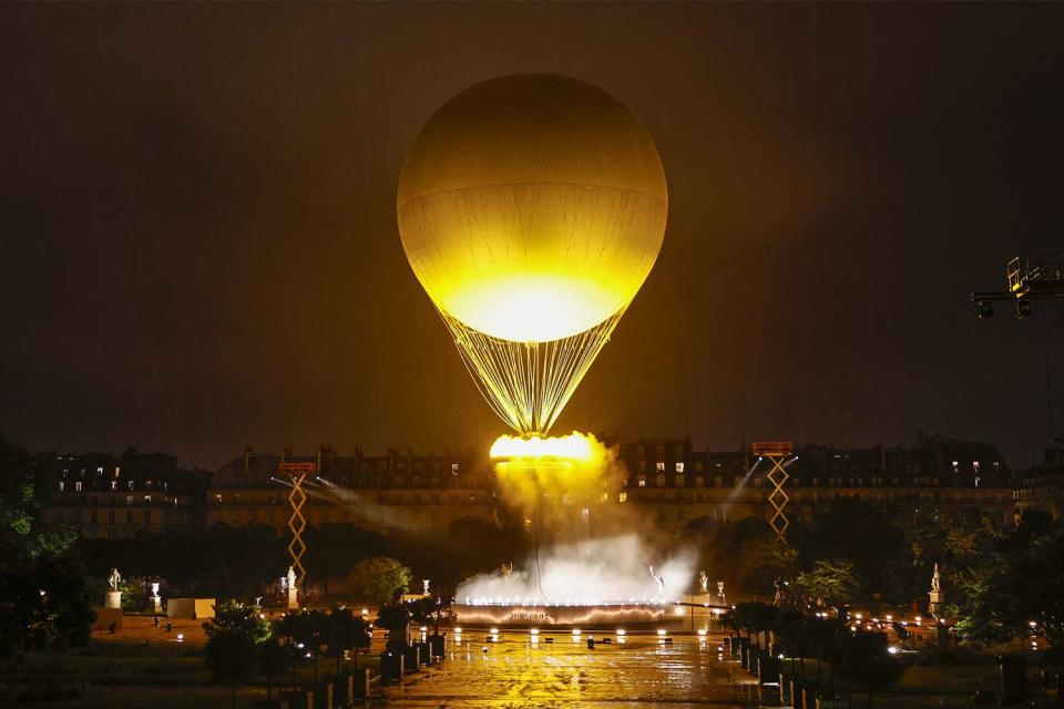 <p>LUIS TATO/AFP via Gett</p> The Olympic cauldron on July 26