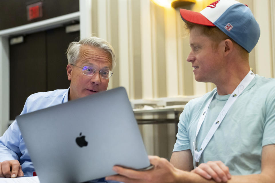 Associate Pronouncer Brian Sietsema, left, and Backup Associate Pronouncer Christian Axelgard talk during a meeting of the word panel to finalize the 2023 Scripps National Spelling Bee words on Sunday, May 28, 2023, at National Harbor in Oxon Hill, Md. (AP Photo/Nathan Howard)