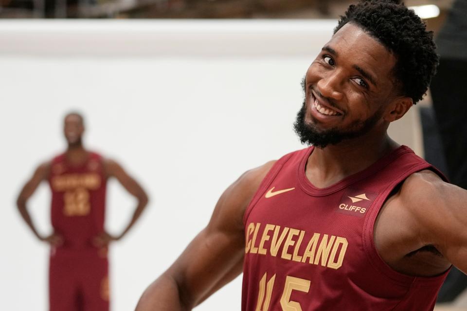 Cavaliers guard Donovan Mitchell gestures to a teammate during media day Monday in Cleveland.