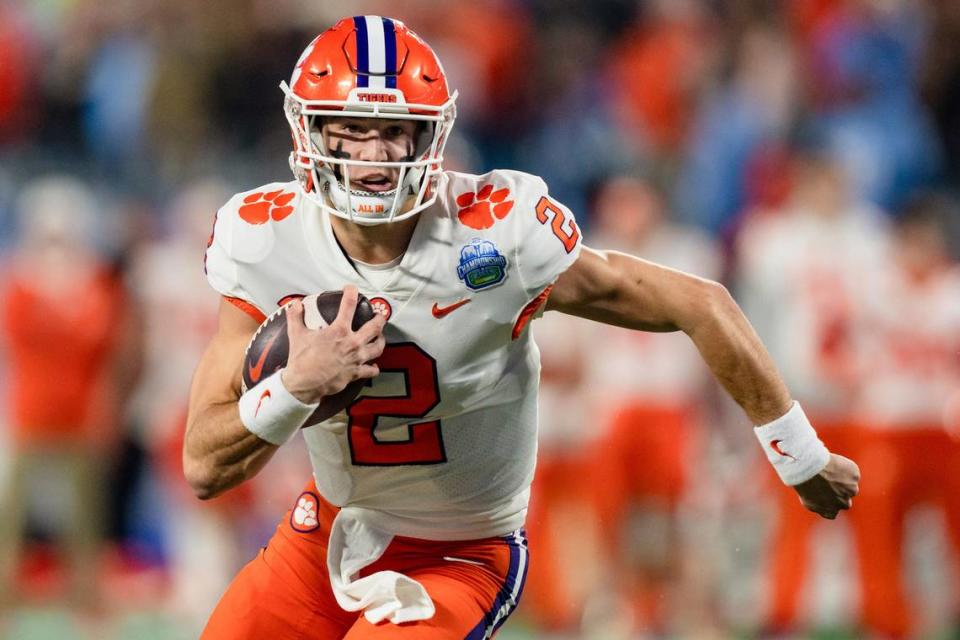 Clemson quarterback Cade Klubnik runs with the ball in the first half during the Atlantic Coast Conference championship NCAA college football game against North Carolina on Saturday, Dec. 3, 2022, in Charlotte, N.C. (AP Photo/Jacob Kupferman)