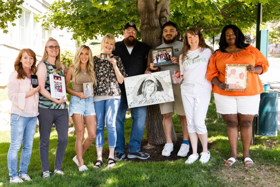 A group of twinless twins poses with photos of their twins at the Hug Tour stop at the Presidential Club Condos in Salt Lake City on Saturday, July 8, 2023. After losing her twin at age 4, Tasha Cram is on a journey to hug 1,000 twins across the U.S. | Megan Nielsen, Deseret News