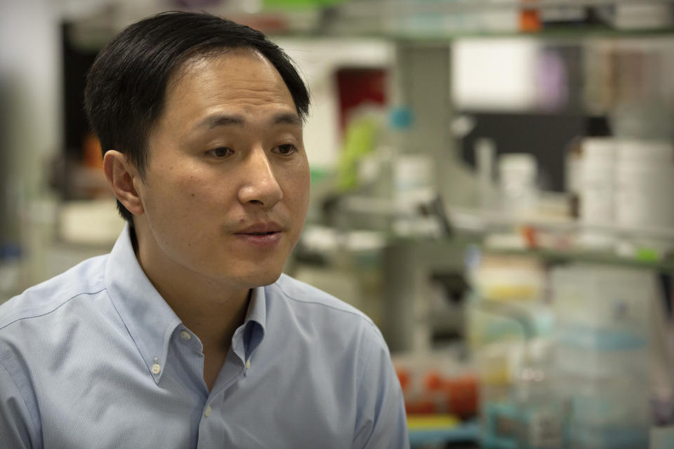 In this Oct. 10, 2018, photo, Chinese scientist He Jiankui speaks during an interview at his laboratory in Shenzhen in southern China's Guangdong province. Chinese state media says the researcher He has been sentenced to three years for practicing medicine illegally. He Jiankui was also fined 3 million yuan. Two others were also sentenced on the same charge. (AP Photo/Mark Schiefelbein)