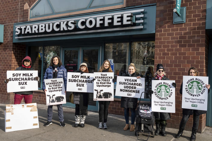 Animal rights activists protest the extra charge in plant-based milk outside a Starbucks in Union Square in New York City on Dec. 21, 2019. (Gabriele Holtermann-Gorden / Sipa USA via AP file)