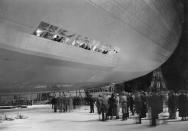 <p>The Hindenburg, Zeppelin LZ-129, being taken out of its hangar at Friedrichshafen before leaving for New Jersey on August 9, 1936. (Fox Photos/Getty Images) </p>