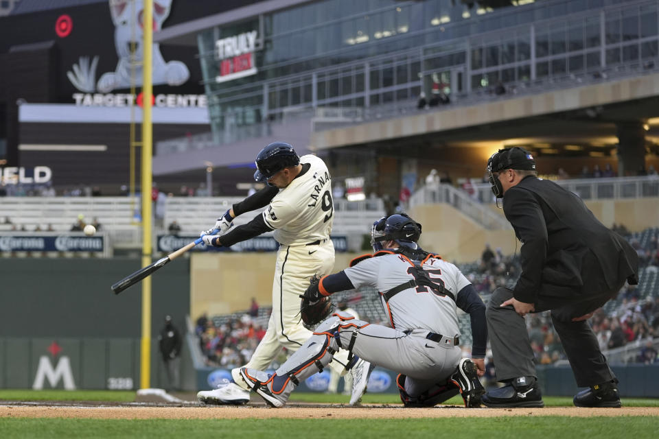Minnesota Twins' Trevor Larnach (9) hits a two-run home run against the Detroit Tigers during the first inning of a baseball game Friday, April 19, 2024, in Minneapolis. (AP Photo/Abbie Parr)