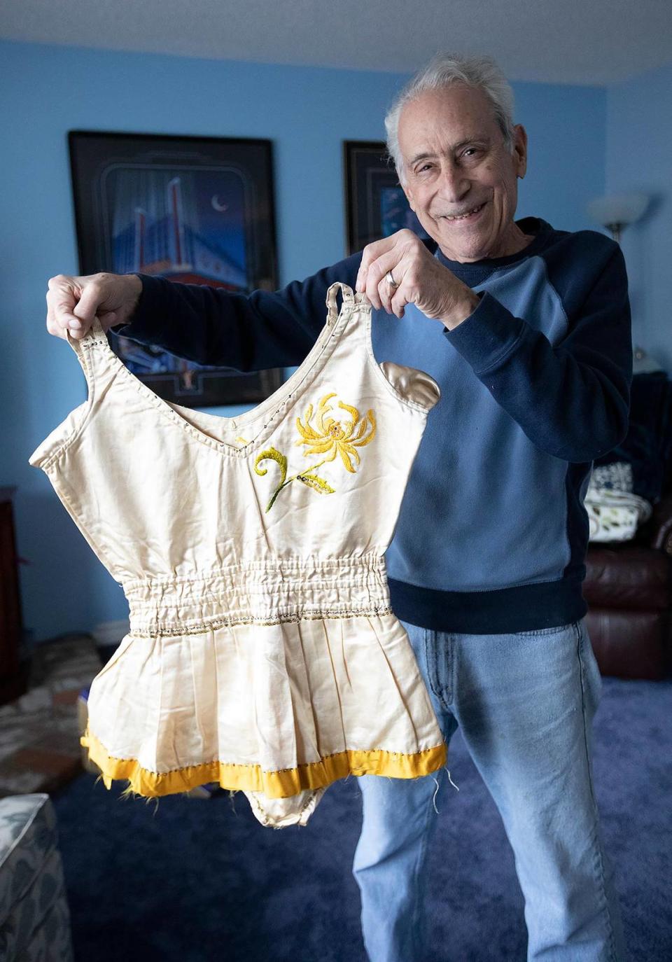 In early January 2022, Jim Major found a box in the basement of his Cambria home that was filled with a trove of early 1900s circus memorabilia from his grandparents, who performed worldwide but mostly in New Zealand and Australia. Here, Major holds an outfit his grandmother wore in the circus.
