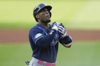 Tampa Bay Rays' Yandy Díaz gestures as he runs to home plate with a home run in the first inning of a baseball game against the Cleveland Guardians, Saturday, Sept. 2, 2023, in Cleveland. (AP Photo/Sue Ogrocki)