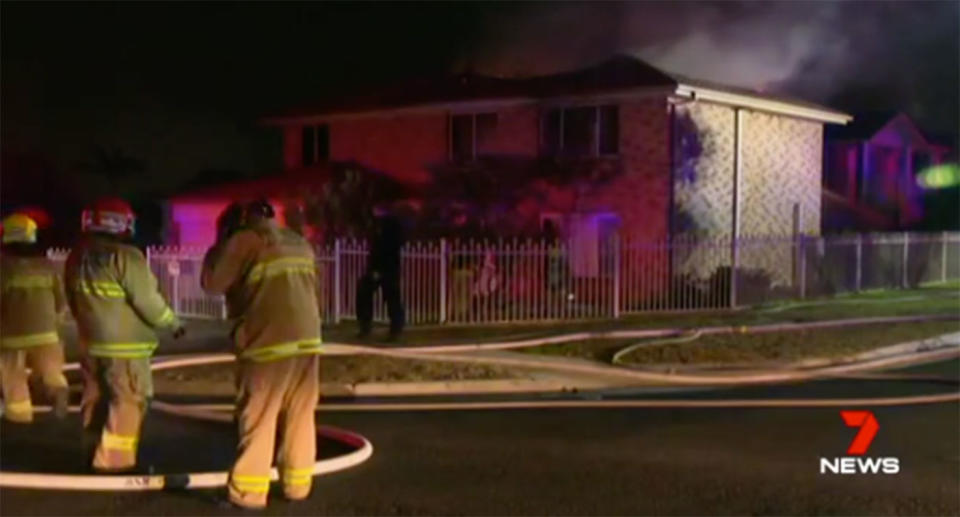 Brave neighbours ran into the flames to drag out an elderly woman and her son from their burning Sydney home. Source: 7 News