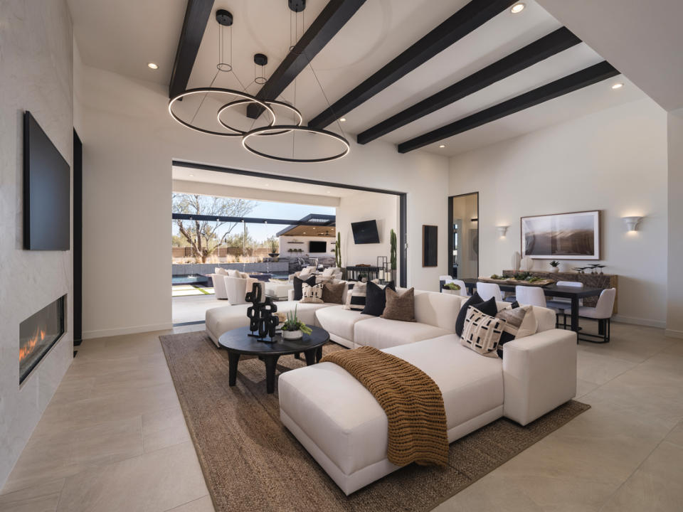 The Kartchner model home at Sonoran Trails by Toll Brothers offers 4,315 square feet of living space with 4 bedrooms, 3.5 bathrooms, and a 4-car tandem garage.