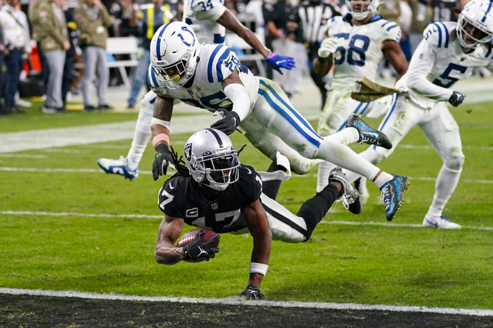 Las Vegas Raiders wide receiver Davante Adams (17) dives for a touchdown as Indianapolis Colts safety Rodney McLeod Jr. (26) defends during the second half of an NFL football game, Sunday, Nov. 13, 2022 in Las Vegas. (AP Photo/Matt York)