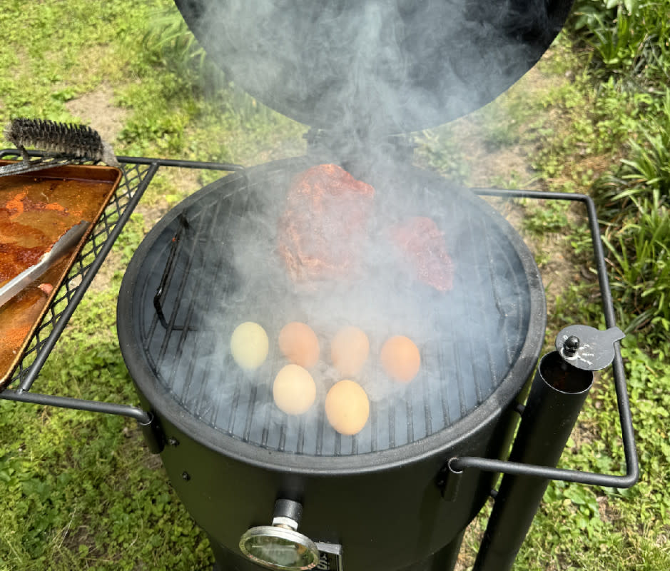 Properly loading up the Oklahoma Joe's Bronco with charcoal and wood will provide hours of smoke and heat.<p>Adam Bible</p>