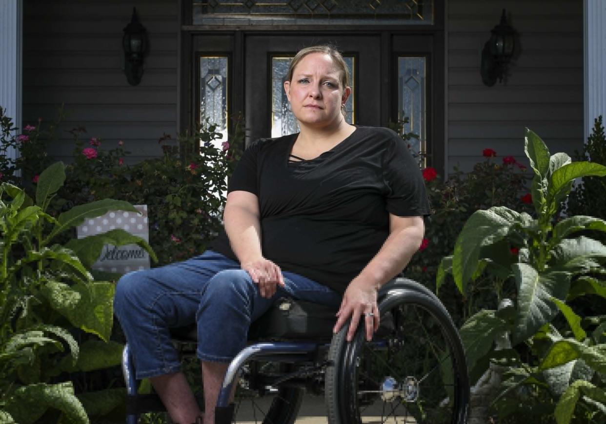 Missy Jenkins Smith poses for a photo at her home on Sept. 9, 2022, in Kirksey, Ky. Smith was paralyzed from the chest down after being shot by Michael Carneal in 1997. 