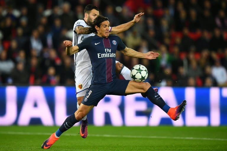 Basel's midfielder Renato Steffen (back) challenges Paris Saint-Germain's forward Edinson Cavani during the UEFA Champions League group A football match between Paris Saint-Germain and Basel on October 19, 2016