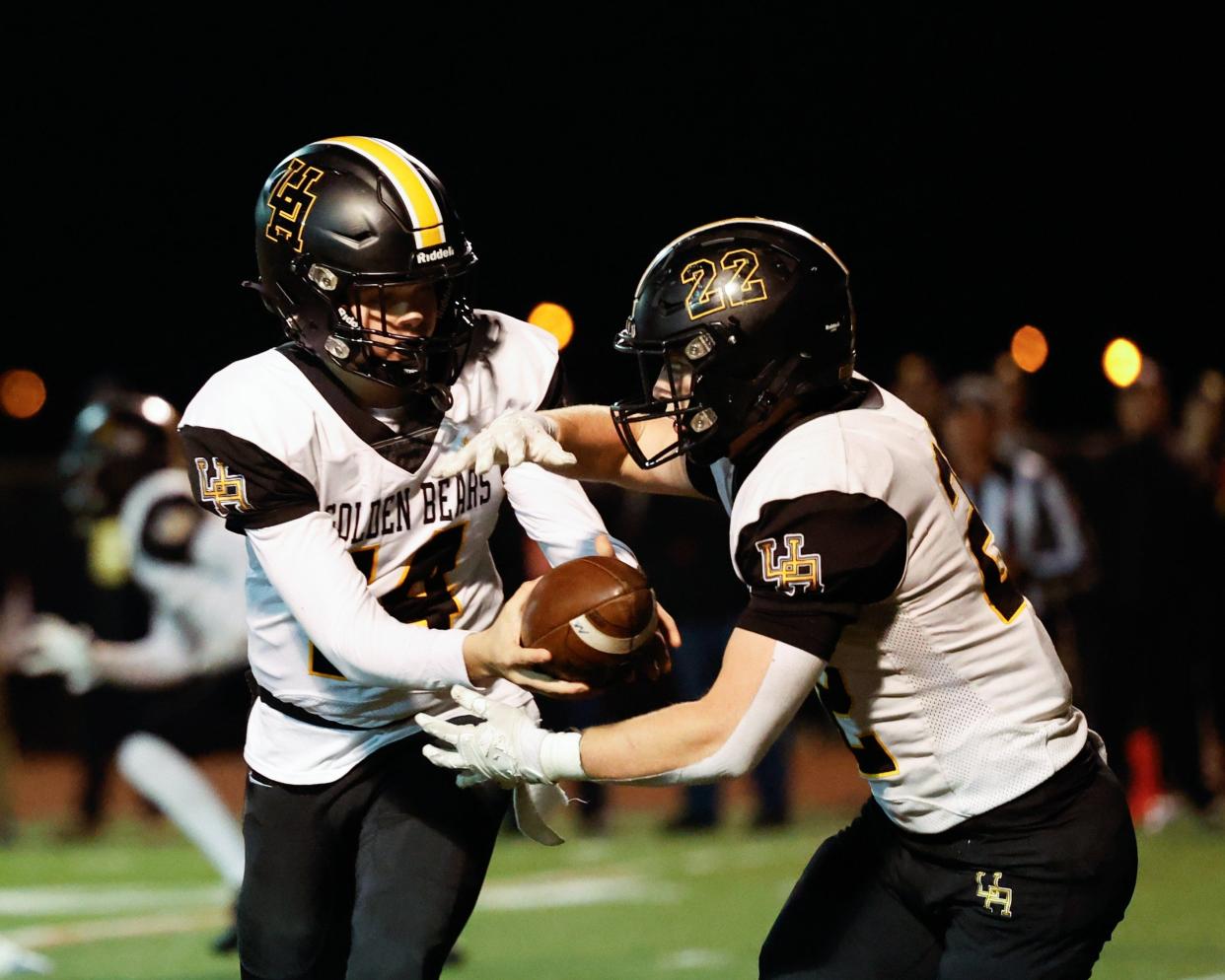 Quarterback Kyle Cox (14), running back Connor McClellan and Upper Arlington face Hilliard Bradley in the Division I, Region 3 final Friday at Historic Crew Stadium.