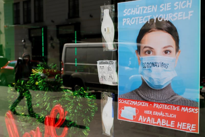 FILE PHOTO: Face masks are on display in a closed shop in Vienna