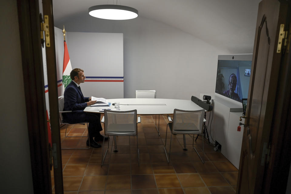 France's President Emmanuel Macron attends an international video conference at the Fort de Bregancon, in Bormes-Les-Mimosas, southern France, Wednesday, Aug. 4, 2021. The virtual event, co-hosted by France and the United Nations, is meant to show support towards Lebanese people, French President Emmanuel Macron said. France will provide 100 millions euros ($118.6 million) in the coming months, Macron said in his opening remarks. (Christophe Simon/Pool Photo via AP)