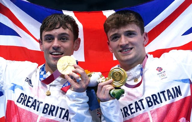 Tom Daley and Matty Lee pose with their Olympic gold medals