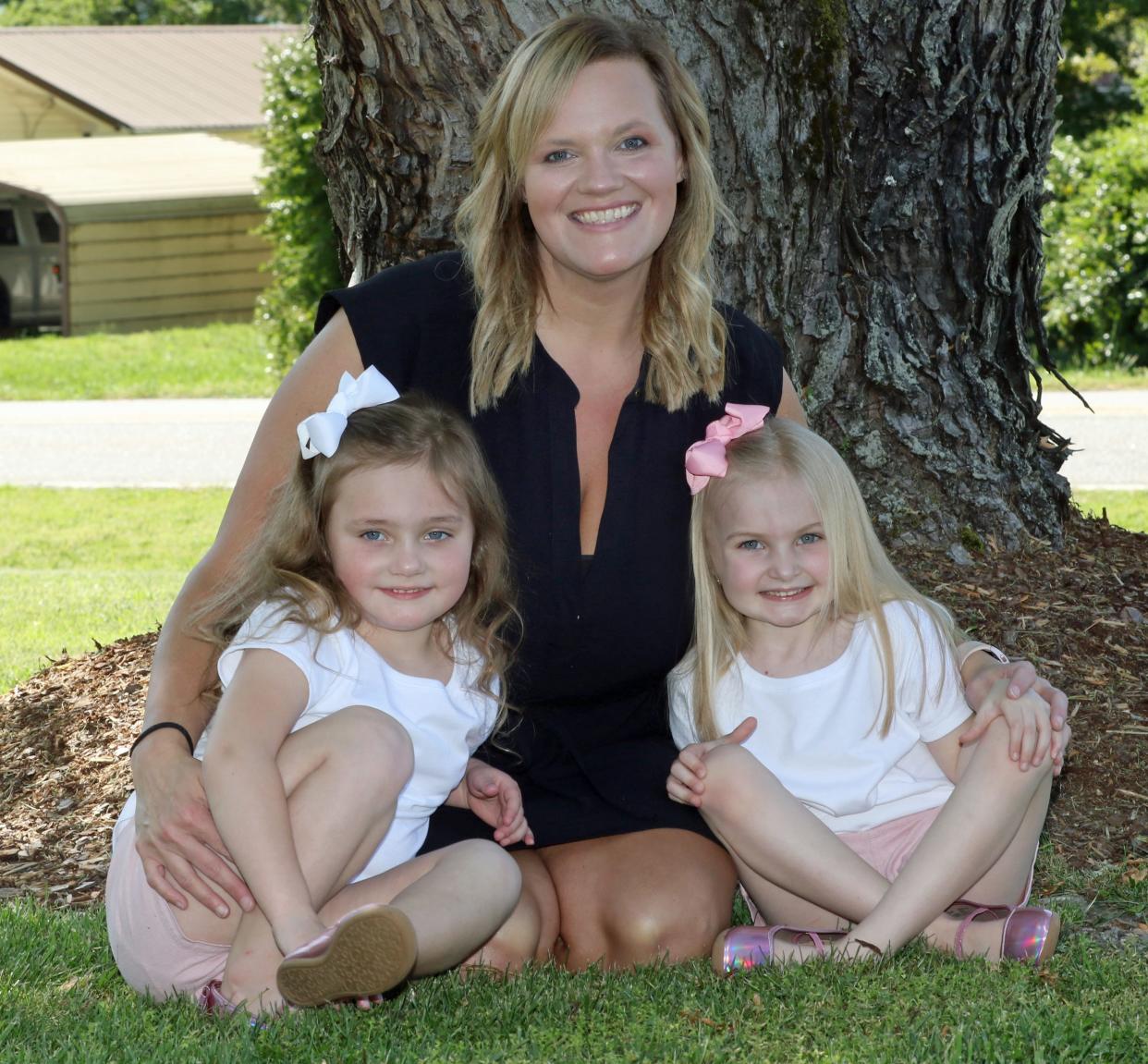 Summer Sheehan poses with her four-year-olds, Oakley and Ivy, Thursday afternoon, April 18, 2024, outside their home in Shelby.
