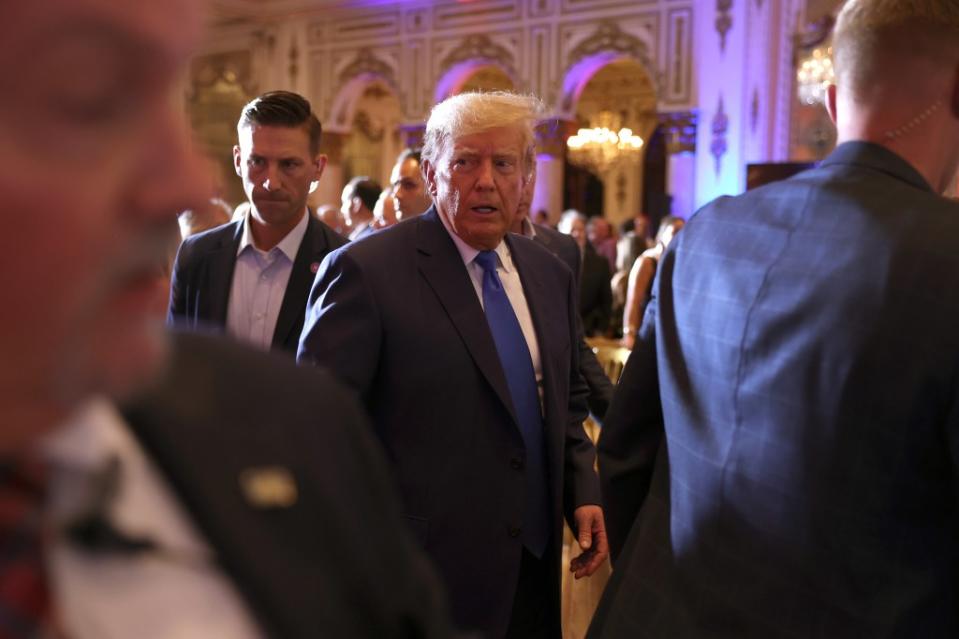 Former President Donald Trump mingles with supporters during an election night event at Mar-a-Lago on November 8, 2022 in Palm Beach, Florida. (Photo by Joe Raedle/Getty Images)