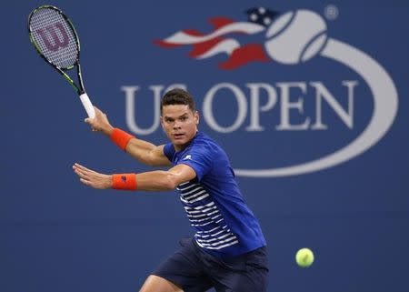 Aug 29, 2016; New York, NY, USA; Milos Raonic of Canada returns a shot to Dustin Brown of Germany on day one of the 2016 U.S. Open tennis tournament at USTA Billie Jean King National Tennis Center. Mandatory Credit: Jerry Lai-USA TODAY Sports