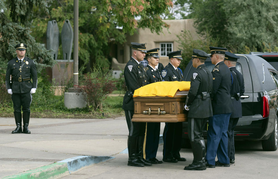 Members of law enforcement from around New Mexico begin to carry the casket of former New Mexico Gov, Bill Richardson outside the New Mexico Capitol building, Wednesday, Sept. 13, 2023, in Santa Fe, N.M. (AP Photo/Roberto E. Rosales)