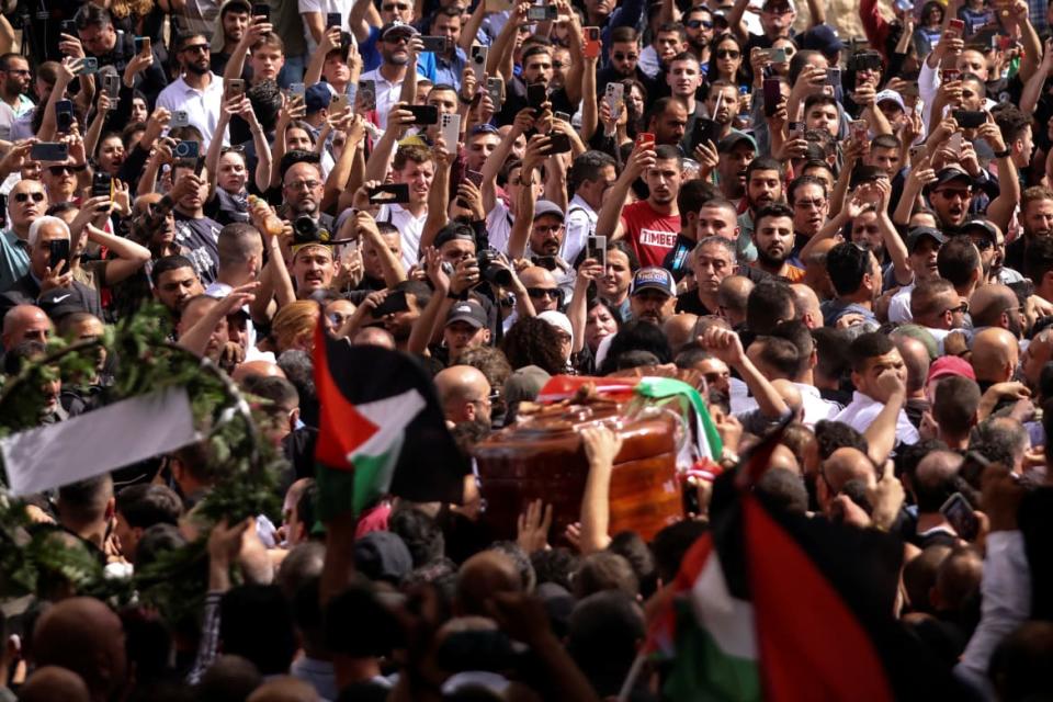 <div class="inline-image__caption"><p>Family and friends carry the coffin of Al Jazeera reporter Shireen Abu Akleh, who was killed during an Israeli raid in Jenin in the occupied West Bank.</p></div> <div class="inline-image__credit">AMMAR AWAD</div>
