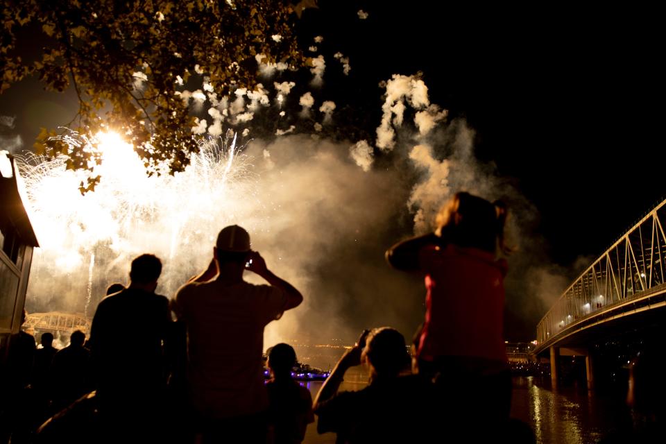 People watch the Western & Southern/WEBN fireworks show at Riverfest on Sunday, Sept. 5, 2021, at  Sawyer Point and Yeatman's Cove in Cincinnati. 