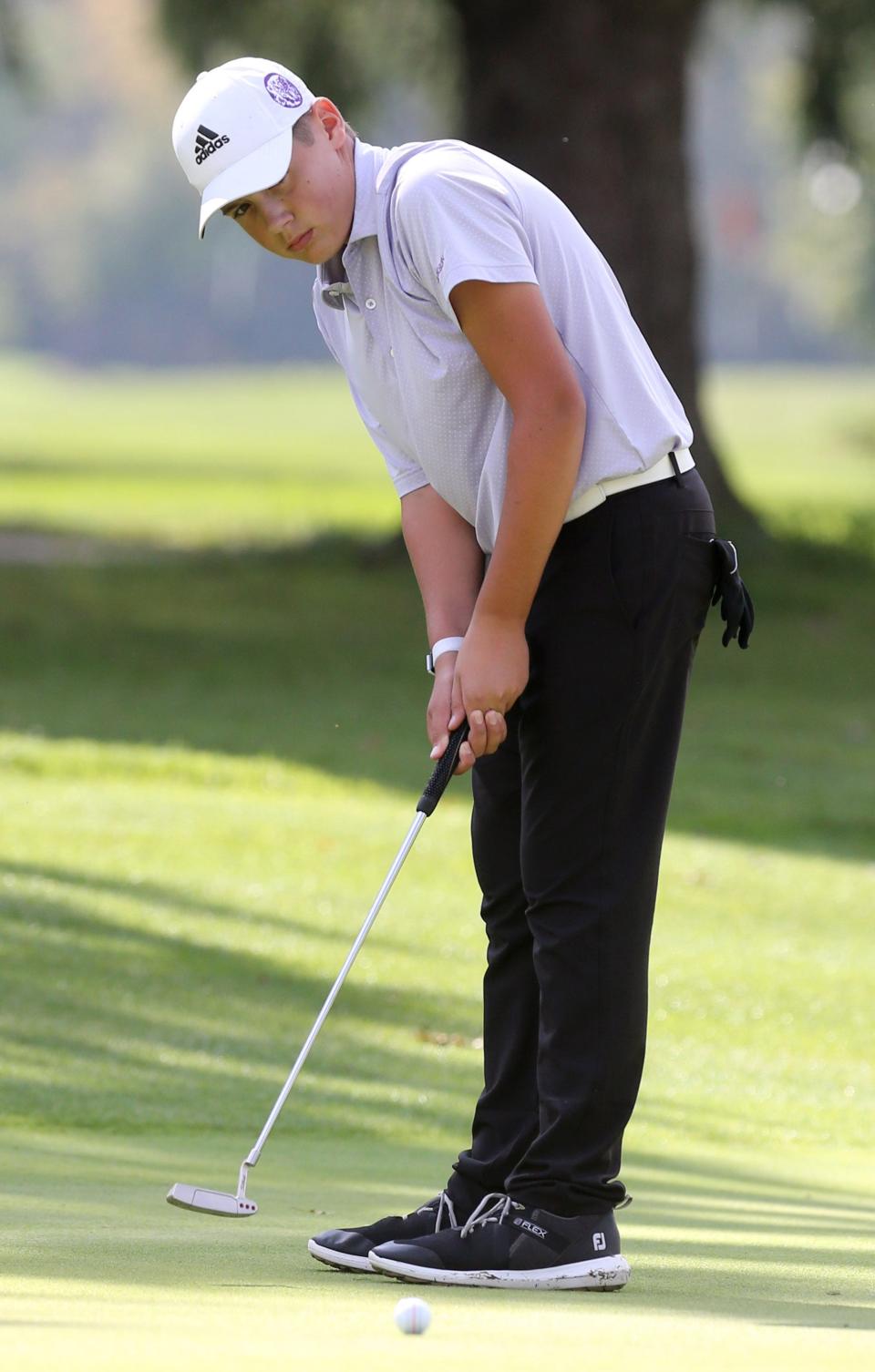 Jordan Kish of Jackson putts on the ninth hole during the DI sectional boys golf tournament at Tannenhauf Golf Club on Tuesday, Oct. 5, 2021. 