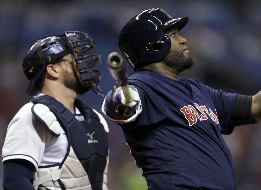 David Ortiz follows through on yet another historic home run in Boston's 2-1 win against Tampa Bay. (AP)